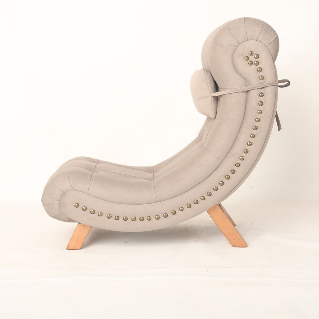 Crescent moon-shaped baby photography prop with a soft cushioned seat, designed in a light pastel color. Ideal for baby photoshoots, the prop is styled to create a dreamy, celestial-themed setting.