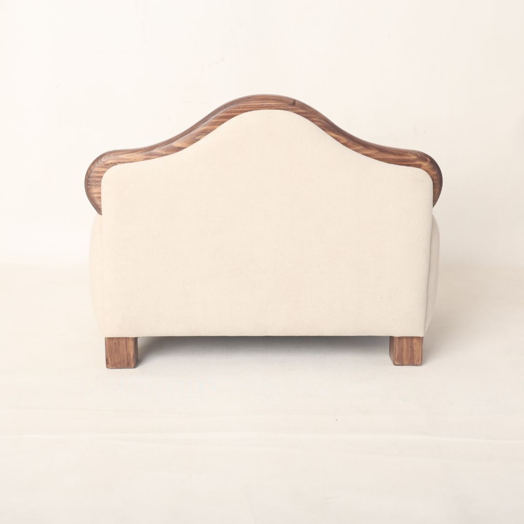 A sleek and elegant wooden sofa baby prop, designed for newborn and sitter photoshoots, offering a stylish and comfortable seating option for capturing timeless baby portraits.